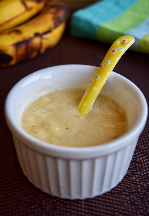 Preparing Baby Food, Homemade. Healthy Smashed Banana Mixed with